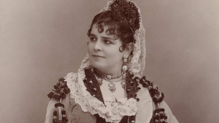 A sepia portrait of the original performer in Carmen, Galli-Marié, in her costume.