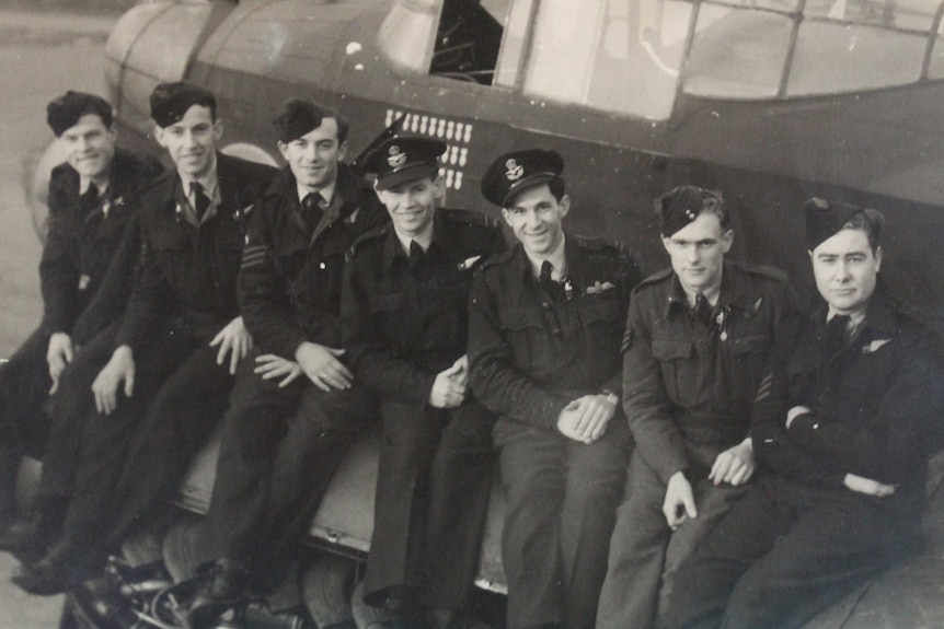 Eric Maxton (far left), Jack Pruss (third from left) and Murray Maxton (third from right) outside a Lancaster Bomber in 1944