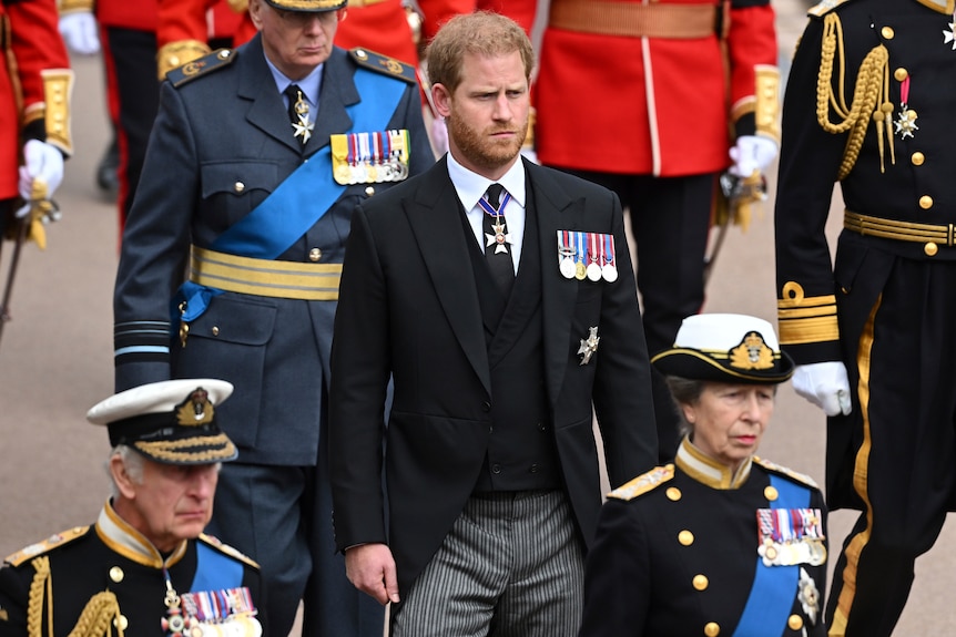 prince harry walks behind his father and aunt as part of procession for queen elizabeth ii's funeral