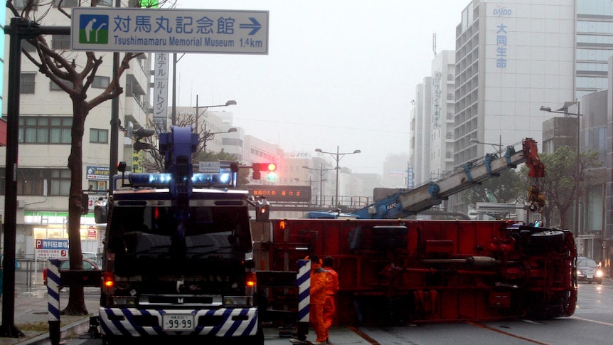 A truck is overturned in Naha city, Okinawa after heavy winds from Typhoon Jelawat in Japan.