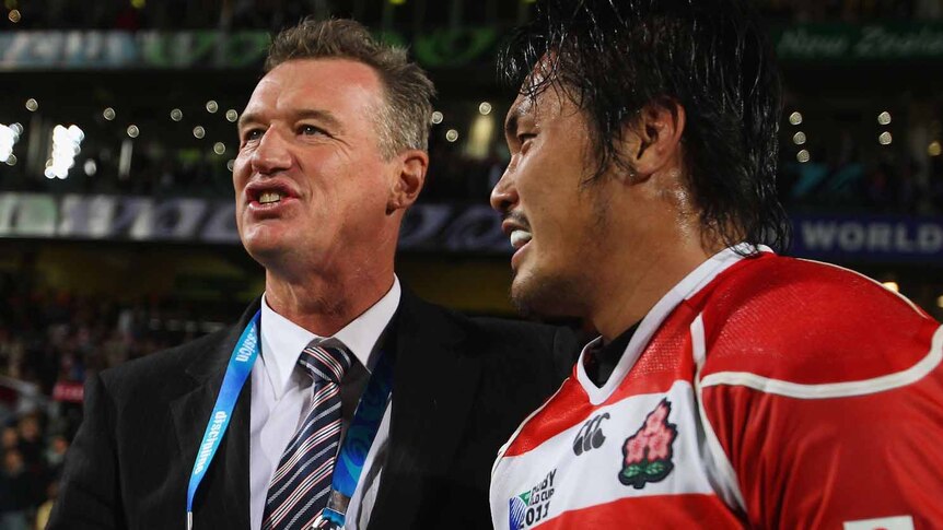 Impressive showing ... Japan coach John Kirwan and flanker Itaru Taniguchi reflect after their encouraging showing against France.