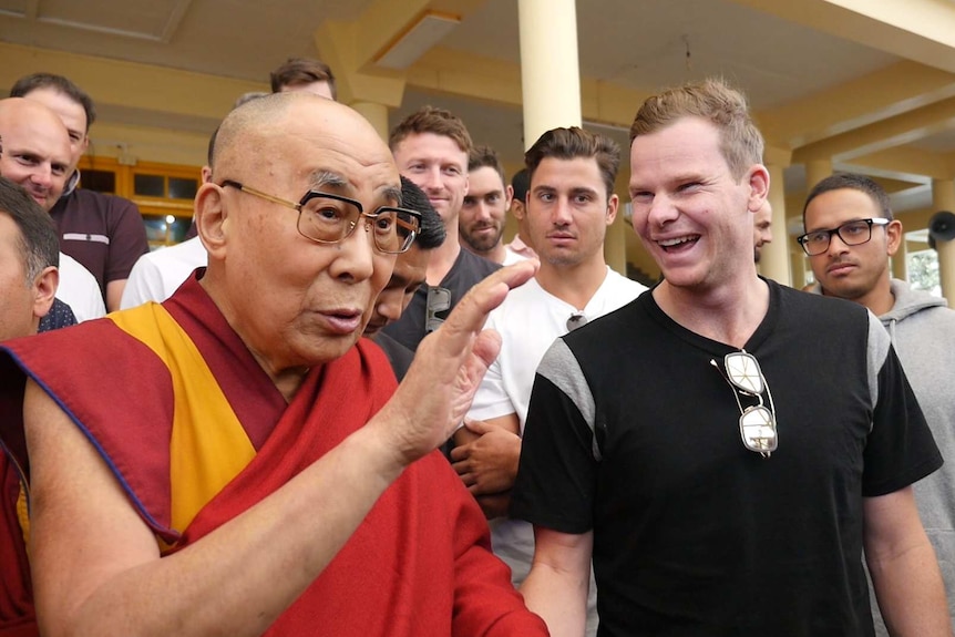 Steve Smith laughs at the Dalai Lama's joke.