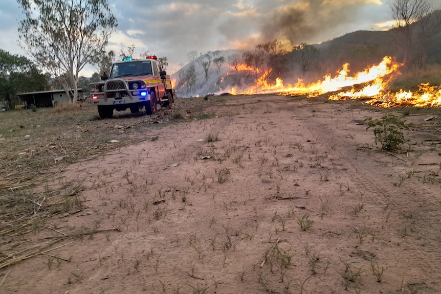 a fire struck next to a line of fire moving through the landscape