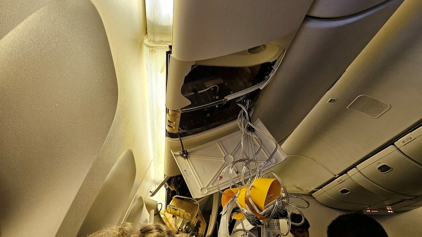 A damaged overhead compartment on flight SQ321