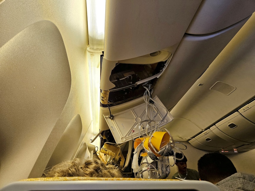 A damaged overhead compartment on flight SQ321