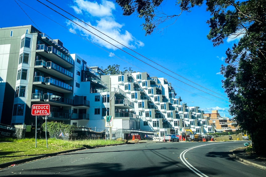 A nearly finished apartment complex on a major road on the Central Coast.