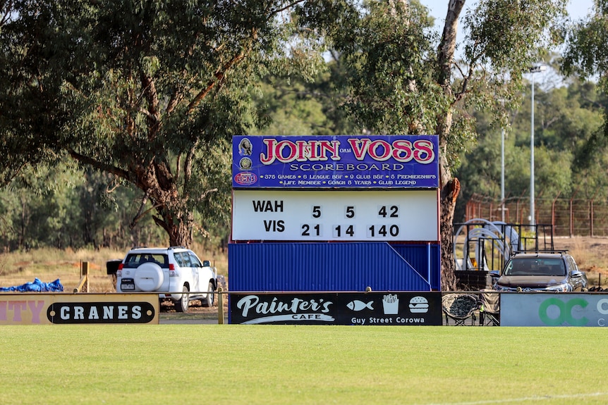 Scoreboard at country football oval showing Wah 5.5 42 to Vis 21.14.140
