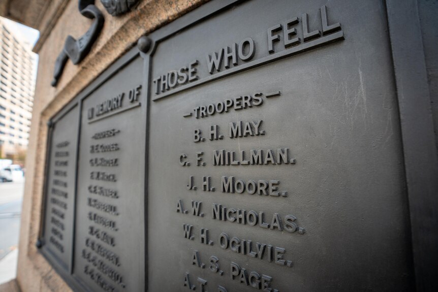 Names on a plaque under 'In Memory of Those Who Fell' 