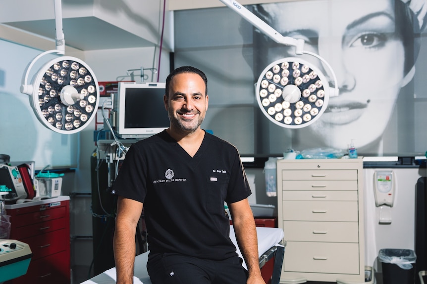 Dr Ben Talei smiles in his surgery room.