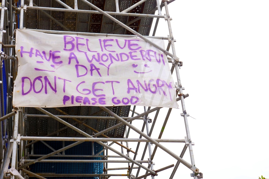 sign connected to scaffolding