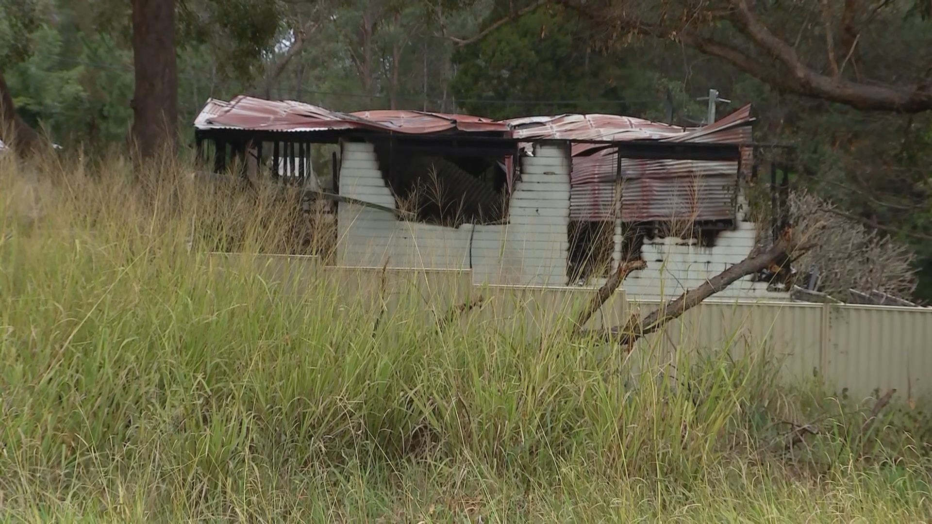 A wooden house damaged by fire 
