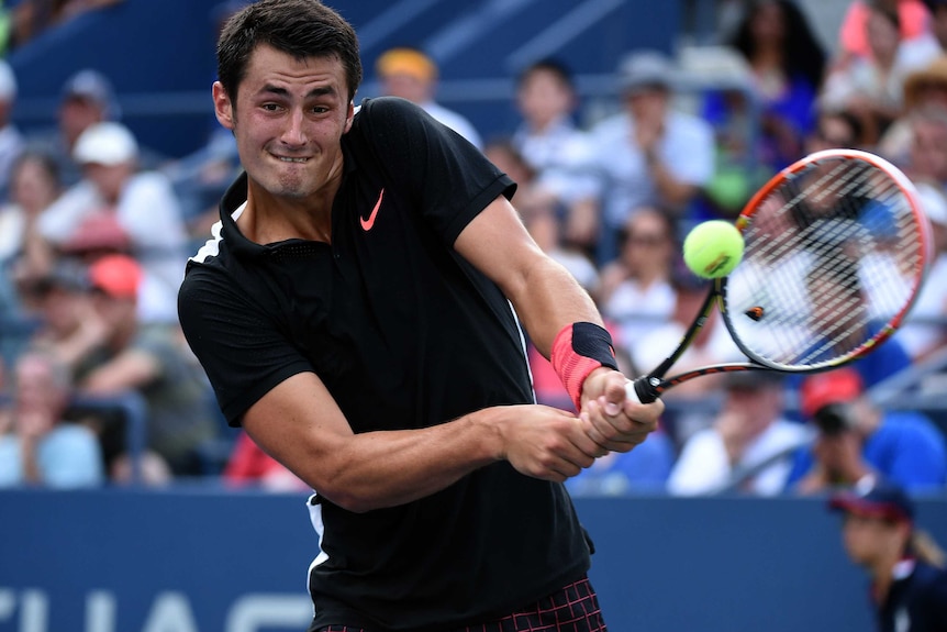 Bernard Tomic on his way to beating Lleyton Hewitt at the US Open