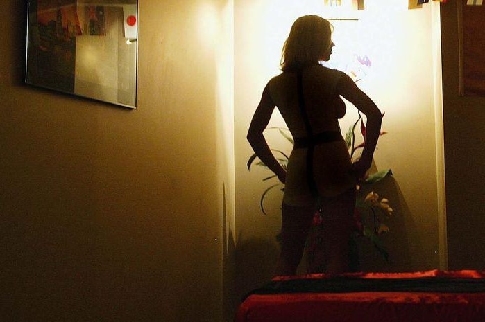 A prostitute at the Melbourne Boardroom in Melbourne, Australia.
