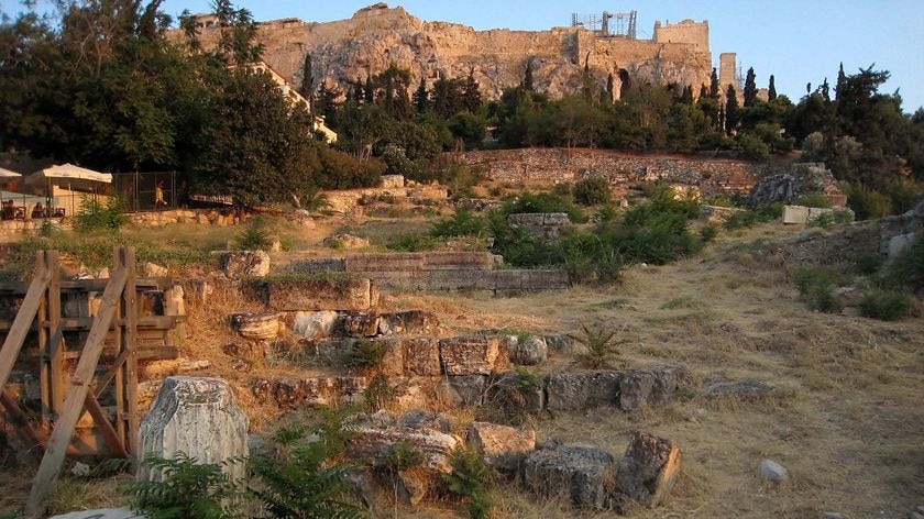 Graffiti covers the remains of ancient pillars beneath the Acropolis in Athens.