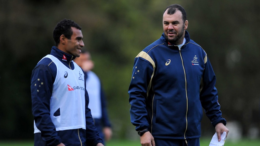 Friendly enemies ... Will Genia (L) and Michael Cheika chat duirng the Wallabies' spring tour