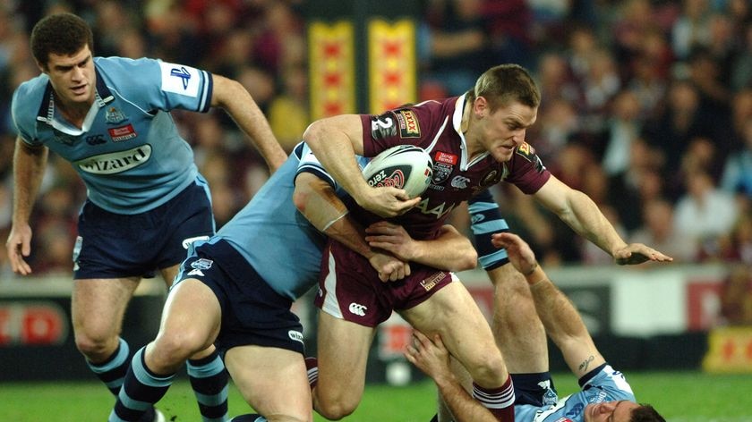 Brent Tate charges the Blues