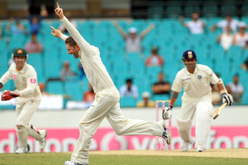 Michael Clarke celebrates taking the wicket of Sachin Tendulkar, out for 80.