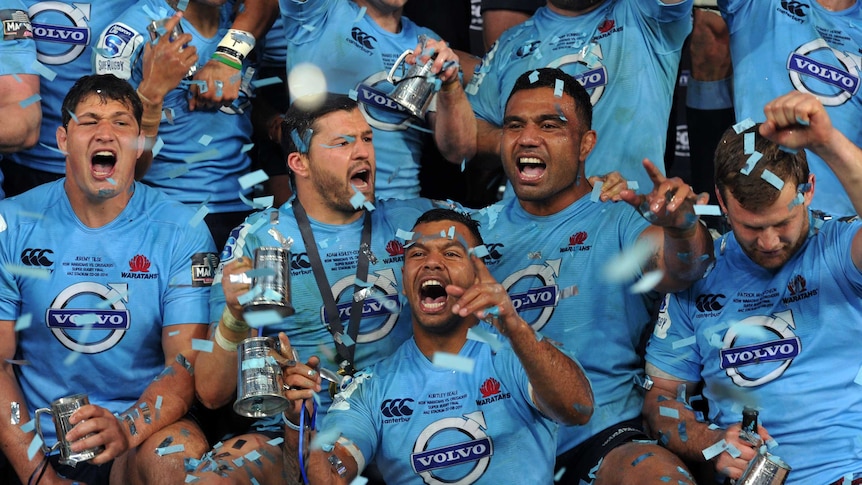 That winning feeling ... Kurtley Beale and the Waratahs celebrate their victory in the Super Rugby final