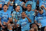 That winning feeling ... Kurtley Beale and the Waratahs celebrate their victory in the Super Rugby final