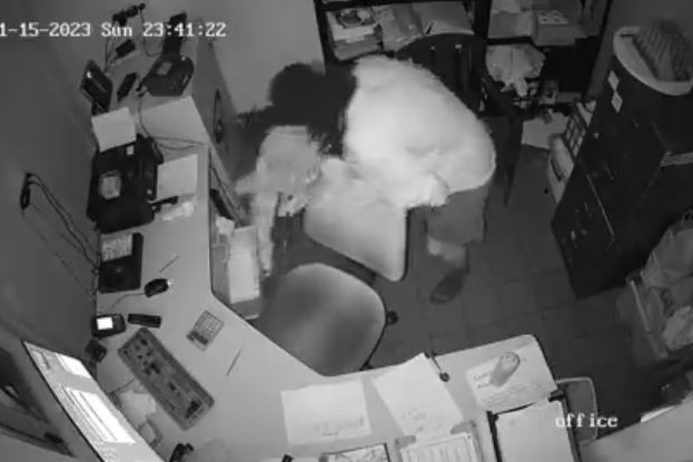 CCTV from a service station camera of two men allegedly stealing cigarettes 