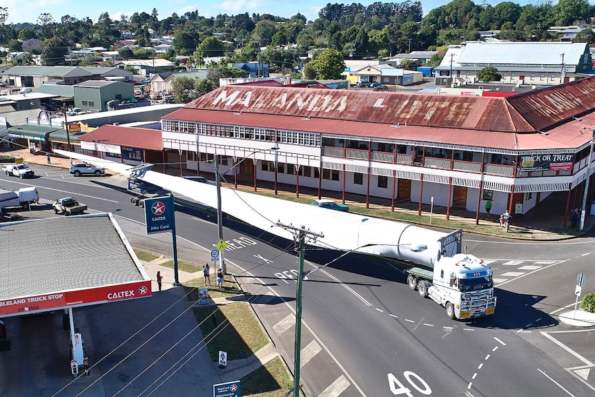 A special semi-trailer transports one of the fan blades for a giant wind farm — each one is 57 metres long — in Malanda.