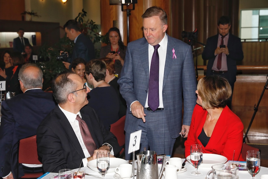 Anthony Albanese talks to Mike Pezzullo and Kristina Keneally at an event