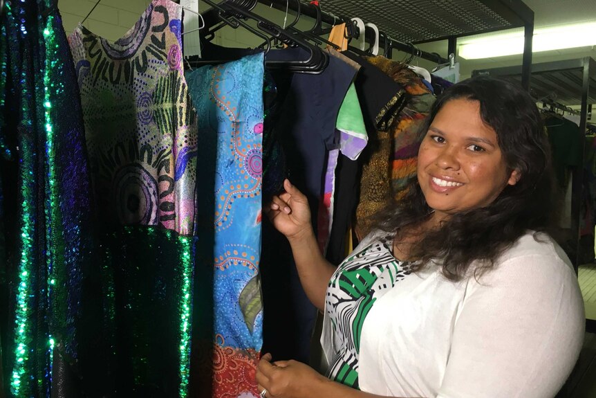 Festival founder Hannah Nungarrayi stands alongside garments