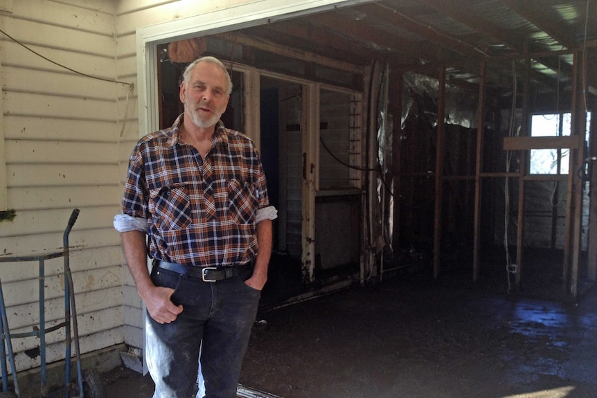 Malcolm Bramich outside his flood-damaged home June 2016