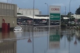A flooded street in Port Lincoln, including a half-submerged car.