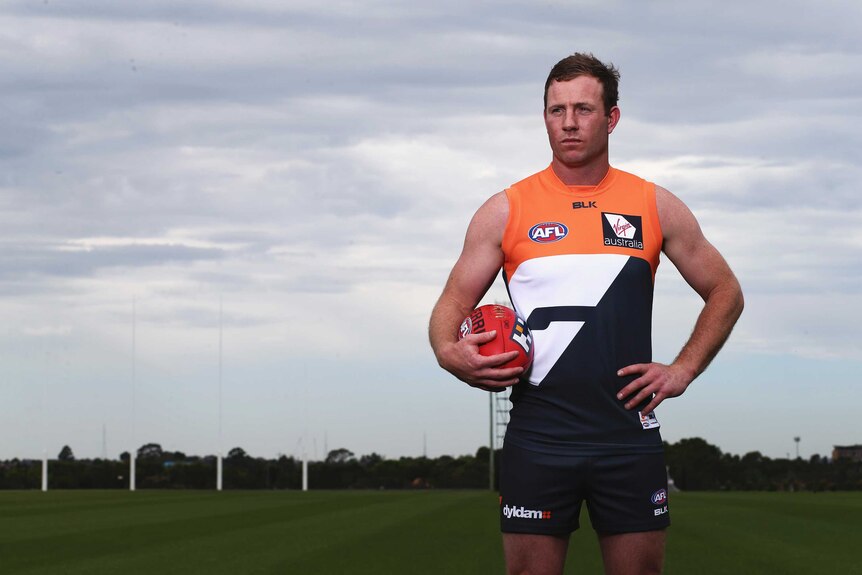 Steve Johnson poses in GWS colours after being traded from Geelong in October 2015.