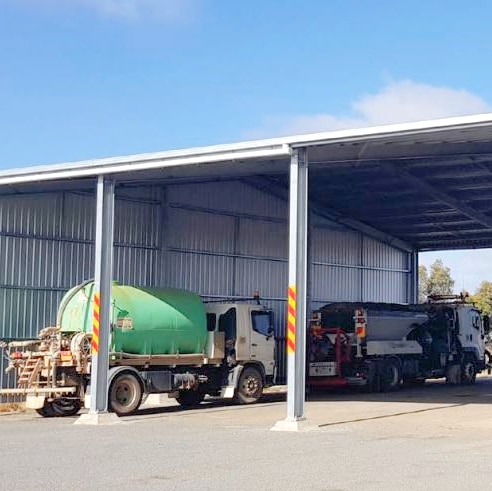 Trucks under a shelter at the Yarriambiack Shire Council's Hopetoun Depot.