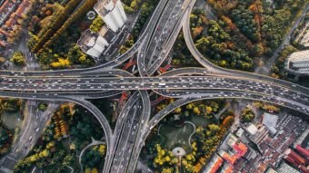 Bird's eye view of traffic across multiple motorways in Shanghai, China.