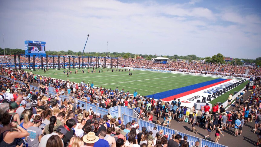 Thousands of spectators pack out an outdoor stadium.