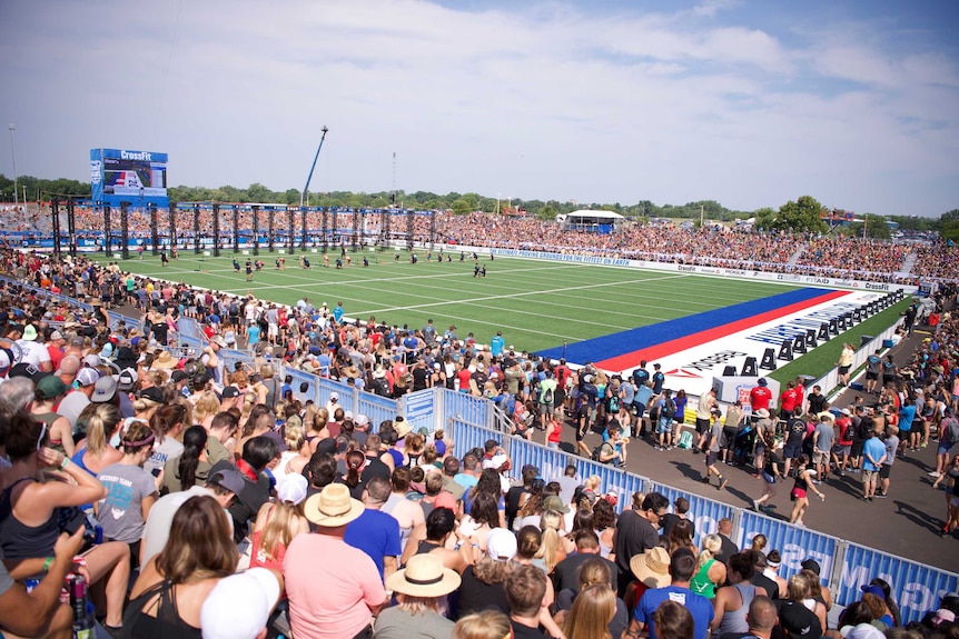 Thousands of spectators pack out an outdoor stadium.