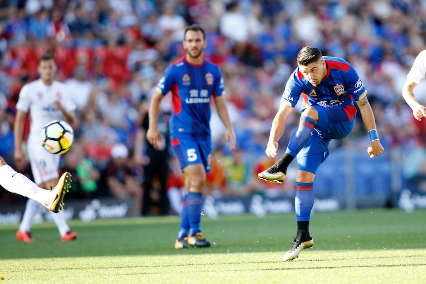 Newcastle Jets' Dimitri Petratos shoots at goal against the Wanderers