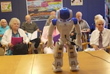 Alice the robot charges up for the Madeley singing group