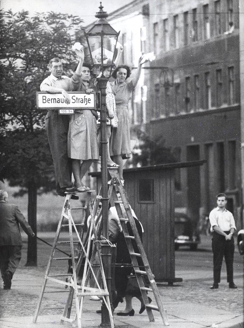 West Berliners wave to friends