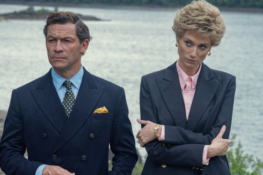 Actors Dominic West and Elizabeth Debicki are wearing suits while portarying Prince Charles and Princess Diana.