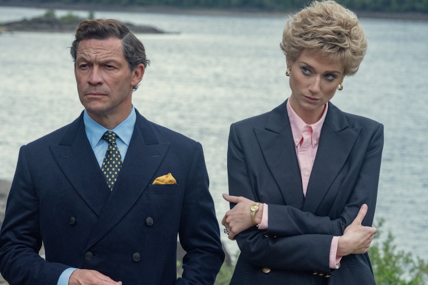 Actors Dominic West and Elizabeth Debicki are wearing suits while portarying Prince Charles and Princess Diana.
