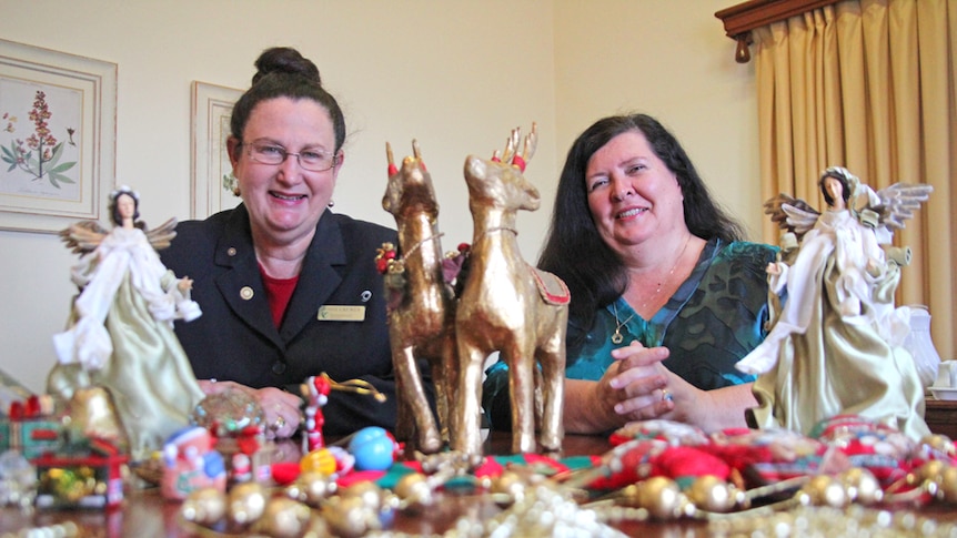 Jenny Crewes from Rotary and Christine Tabone from FSG with some donated Christmas decorations.