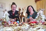 Jenny Crewes from Rotary and Christine Tabone from FSG with some donated Christmas decorations.