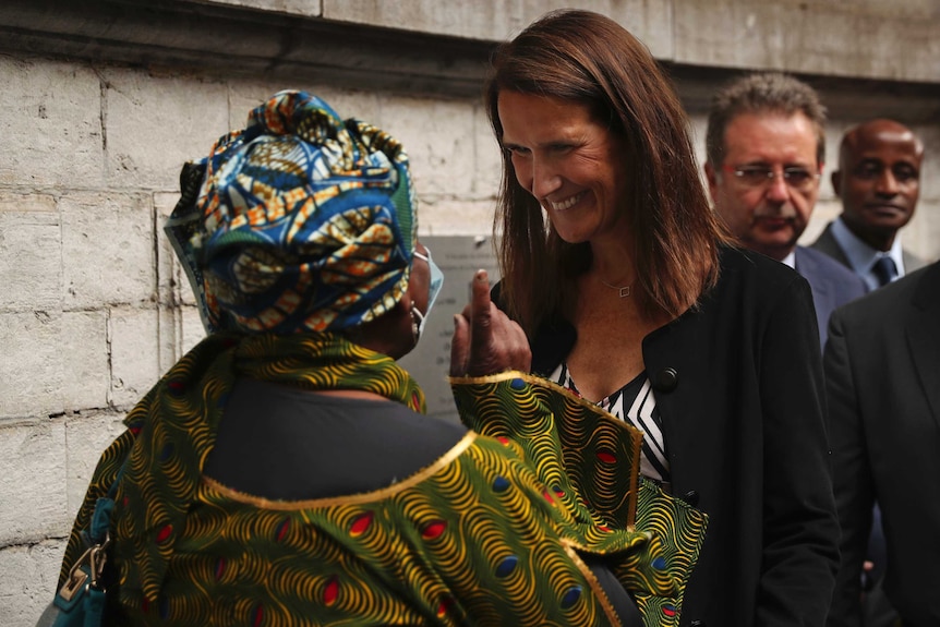 Belgium's Prime Minister Sophie Wilmes speaks with the public after unveiling a plaque marking Congolese independence.