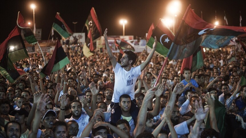 Libyans celebrate what the rebels claim to be the first uprising in Tripoli at Freedom Square in Benghazi, Libya.