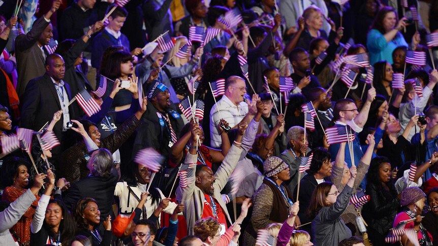 Supporters of US president Barack Obama cheer upon the announcement of election results