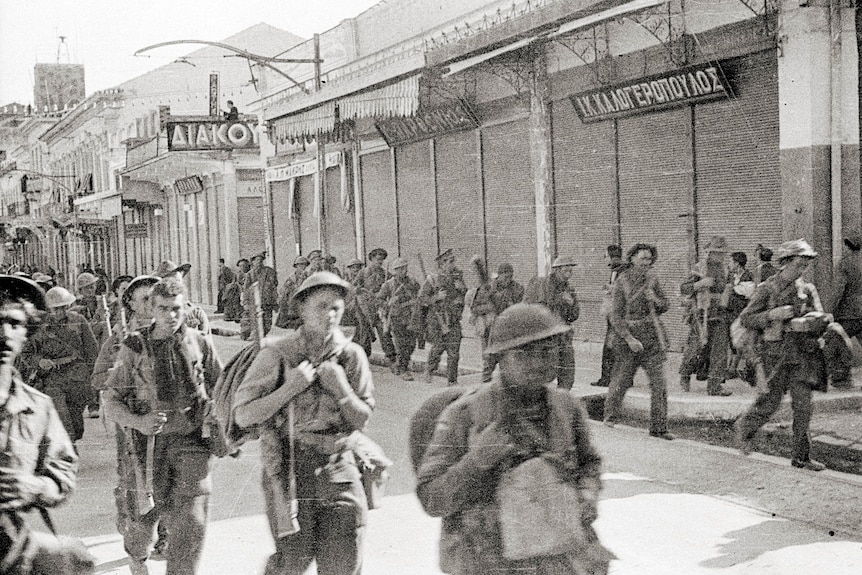 British and Australian troops marching through a street in Kalamata, Greece
