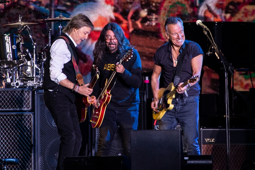 Paul McCartney, from left, Dave Grohl and Bruce Springsteen perform at Glastonbury Festival in Worthy Farm.