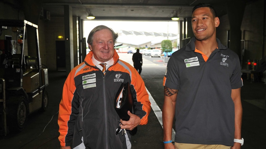 Kevin Sheedy accompanying Israel Folau