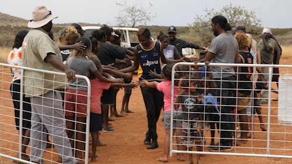 a group of people near a gate