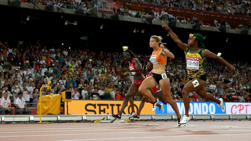 Jamaica's Shelly-Ann Fraser-Pryce (R) beats Dafne Schippers (2nd L) for 100m world title.