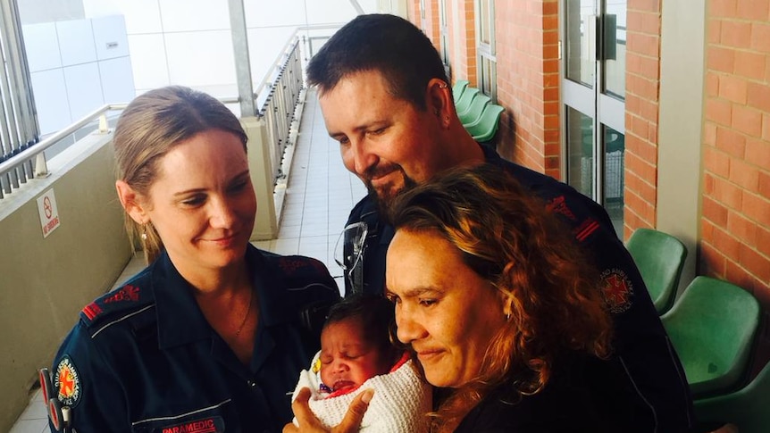 Cairns paramedics Rebecca Howell and Michael Papa helped deliver baby born Damien